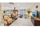 Large basement rec room featuring TV, seating, ping pong table, and kitchenette area at 2972 Nw Stilesboro Nw Rd, Kennesaw, GA 30152