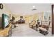 Open basement space with tv, tables, seating, and walk-up staircase at 2972 Nw Stilesboro Nw Rd, Kennesaw, GA 30152