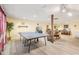 Spacious basement featuring a ping pong table, dining area, and wood laminate flooring at 2972 Nw Stilesboro Nw Rd, Kennesaw, GA 30152