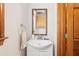 Bathroom with a white vanity, framed mirror, towel and wood trim at 2972 Nw Stilesboro Nw Rd, Kennesaw, GA 30152