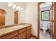 Bathroom with granite countertop and wood cabinetry at 2972 Nw Stilesboro Nw Rd, Kennesaw, GA 30152