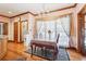 Inviting dining area with hardwood floors and natural light flowing in from a large window at 2972 Nw Stilesboro Nw Rd, Kennesaw, GA 30152