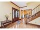 Elegant entryway with hardwood floors, wooden staircase and detailed trim at 2972 Nw Stilesboro Nw Rd, Kennesaw, GA 30152