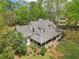 Charming home with a welcoming front porch, dormer windows, and a well-manicured lawn at 2972 Nw Stilesboro Nw Rd, Kennesaw, GA 30152