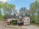 Back of house with multiple levels, deck and garage with driveway at 2972 Nw Stilesboro Nw Rd, Kennesaw, GA 30152