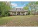 Charming home featuring a welcoming porch, dormer windows, and lush front lawn at 2972 Nw Stilesboro Nw Rd, Kennesaw, GA 30152