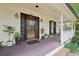 Front porch with number, wooden deck, plants and trim at 2972 Nw Stilesboro Nw Rd, Kennesaw, GA 30152