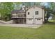 Rear side of the house showing the garages, driveway, and basketball hoop at 2972 Nw Stilesboro Nw Rd, Kennesaw, GA 30152