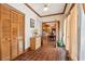 Hallway with tiled floors, wooden closet doors and a wooden framed opening to another room at 2972 Nw Stilesboro Nw Rd, Kennesaw, GA 30152