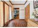 Hallway with tiled floors, a closet with wooden doors and a view into other rooms at 2972 Nw Stilesboro Nw Rd, Kennesaw, GA 30152