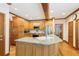 Spacious kitchen with an island, wooden cabinets, and stainless steel appliances at 2972 Nw Stilesboro Nw Rd, Kennesaw, GA 30152