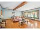 Relaxing living room featuring hardwood floors, exposed beam, and cozy seating at 2972 Nw Stilesboro Nw Rd, Kennesaw, GA 30152