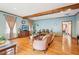 Comfortable living room with hardwood floors, exposed beam, and stylish furnishings at 2972 Nw Stilesboro Nw Rd, Kennesaw, GA 30152