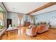 Inviting living room with hardwood floors, a large window, and cozy seating arrangement at 2972 Nw Stilesboro Nw Rd, Kennesaw, GA 30152