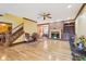 Open living area featuring a fireplace, hardwood floors, staircase, and access to dining area at 2972 Nw Stilesboro Nw Rd, Kennesaw, GA 30152