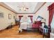 Spacious main bedroom features wood floors, tray ceiling, and sitting area by window at 2972 Nw Stilesboro Nw Rd, Kennesaw, GA 30152
