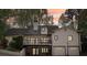 Exterior of home featuring large back deck and a two car garage with a basketball hoop at 2972 Nw Stilesboro Nw Rd, Kennesaw, GA 30152