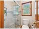 Bathroom shower with sliding glass doors, tiled walls and chrome fixtures at 2972 Nw Stilesboro Nw Rd, Kennesaw, GA 30152