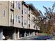 Multi-story condo building featuring a modern design and convenient garage parking at 35 Moda Ln, Atlanta, GA 30316