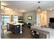 Open-concept living room with kitchen island, pendant lights, and contemporary decor at 35 Moda Ln, Atlanta, GA 30316