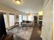 Cozy living room featuring a comfortable sofa, area rug, and access to modern kitchen at 35 Moda Ln, Atlanta, GA 30316