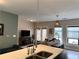 Bright living space featuring an open floor plan, modern pendant lighting, and stainless sink at 35 Moda Ln, Atlanta, GA 30316