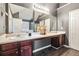 Elegant bathroom featuring double sinks, a large mirror, and neutral-colored walls at 4180 West Stubbs Rd, College Park, GA 30349