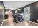 Open-concept kitchen boasts dark cabinets, an eat-in bar, and access to the backyard at 4180 West Stubbs Rd, College Park, GA 30349