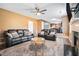 Spacious living room featuring a fireplace, plush seating and an open view into the kitchen at 4180 West Stubbs Rd, College Park, GA 30349