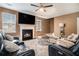 Inviting living room features a cozy fireplace, plush seating, and natural light from large window at 4180 West Stubbs Rd, College Park, GA 30349