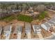 Aerial view of the property and neighborhood with mature trees and well-maintained lawns at 9032 Jim Purcell Dr, Covington, GA 30014