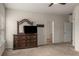 Bedroom featuring a classic dresser with a mirror and a television, offering ample storage space at 9032 Jim Purcell Dr, Covington, GA 30014