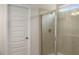 Shower with glass door and tiled surround, offering a sleek and modern design at 9032 Jim Purcell Dr, Covington, GA 30014