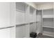 Spacious walk-in closet with adjustable shelving and rods, offering ample storage options at 9032 Jim Purcell Dr, Covington, GA 30014
