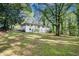 Expansive backyard with mature trees surrounding the home for privacy at 2685 Glenvalley Dr, Decatur, GA 30032