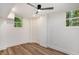 Finished basement offers a modern ceiling fan and hardwood floors at 2685 Glenvalley Dr, Decatur, GA 30032