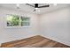 Bright bedroom featuring hardwood floors, a ceiling fan, recessed lighting and a large window at 2685 Glenvalley Dr, Decatur, GA 30032