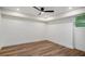 Bedroom featuring hardwood floors, a ceiling fan, recessed lighting and a large window at 2685 Glenvalley Dr, Decatur, GA 30032