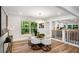 Chic dining area with modern lighting, hardwood floors, and backyard views at 2685 Glenvalley Dr, Decatur, GA 30032