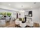 Bright dining area with open layout, connecting the living room, hardwood floors, and modern decor at 2685 Glenvalley Dr, Decatur, GA 30032