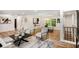 Open-concept living and dining area with modern furniture, hardwood floors, and natural light at 2685 Glenvalley Dr, Decatur, GA 30032