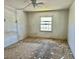 This bedroom features a ceiling fan, a window, and dated decor at 3038 Parc Lorraine, Lithonia, GA 30038