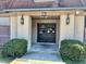 Apartment building entrance with double doors, building number, and exterior lanterns at 3038 Parc Lorraine, Lithonia, GA 30038