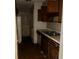 A small kitchen with linoleum flooring and outdated cabinetry and appliances at 3038 Parc Lorraine, Lithonia, GA 30038