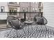 Balcony with modern furniture, a table with wine glasses, and a decorative rug provides a comfortable outdoor space at 388 Pratt Se Dr # 2123, Atlanta, GA 30315