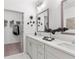 Elegant bathroom with double sinks, modern fixtures, stylish mirrors, and a walk-in closet at 388 Pratt Se Dr # 2123, Atlanta, GA 30315
