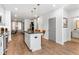 Bright kitchen with stainless steel appliances, island with bar stool seating, and a view to the living area at 388 Pratt Se Dr # 2123, Atlanta, GA 30315