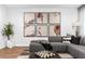 A spacious living room featuring a comfortable gray sectional and modern decor at 388 Pratt Se Dr # 2123, Atlanta, GA 30315