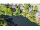 A tranquil lakefront neighborhood showcasing beautiful homes surrounded by lush greenery and mature trees at 4730 W Forest Peak, Marietta, GA 30066