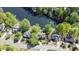 Aerial view of a neighborhood featuring beautiful homes nestled along a scenic lake with lush landscaping at 4730 W Forest Peak, Marietta, GA 30066